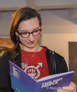 Exhibition guest enjoying the Twilight People booklet - special edition